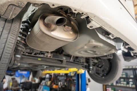 Car exhaust pipe in garage